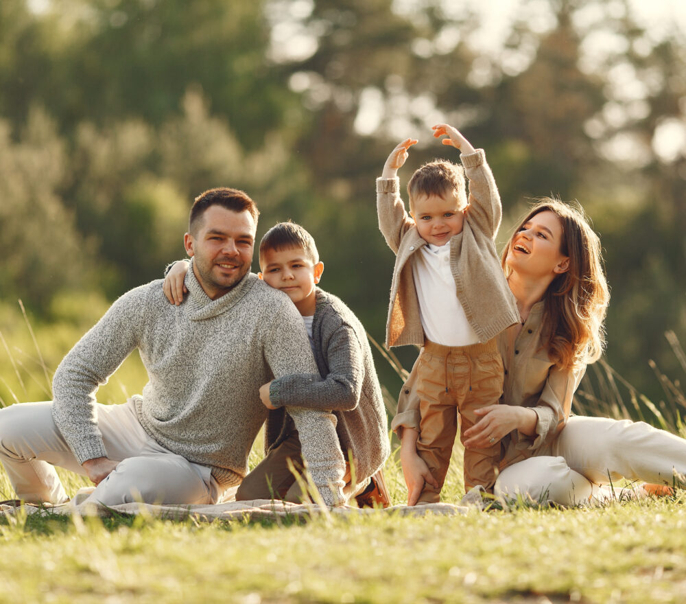 Cute family playing in a summer field