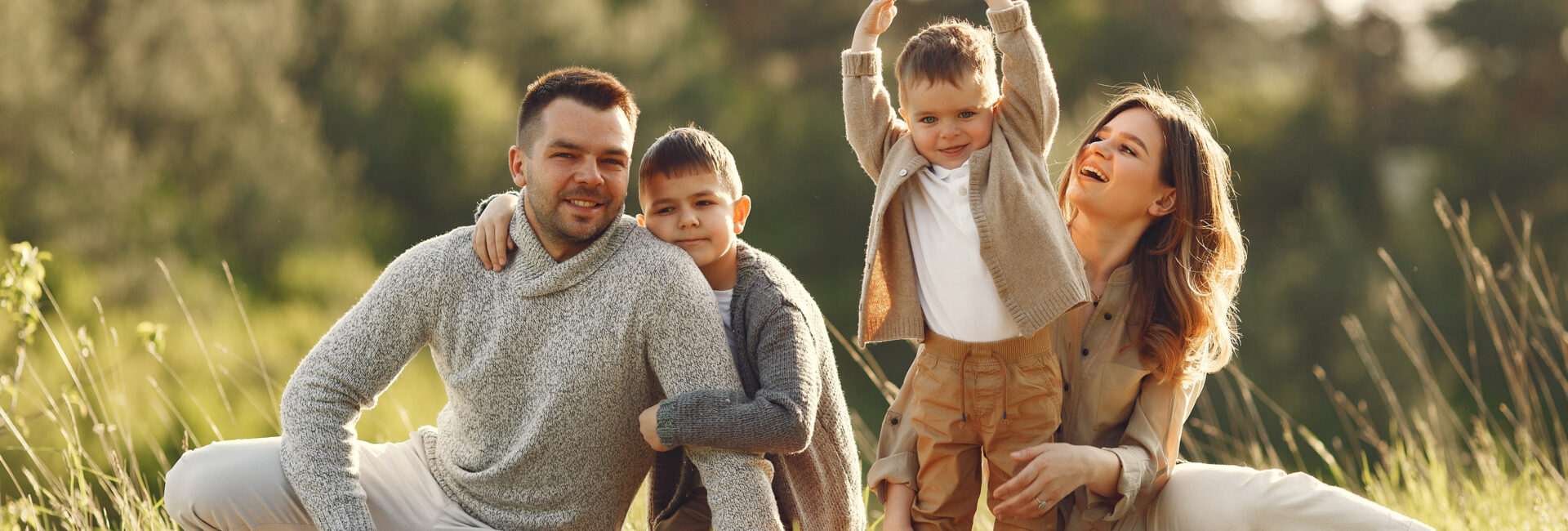 Cute family playing in a summer field